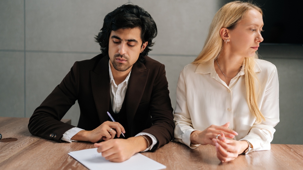 Unhappy man and woman filing divorce