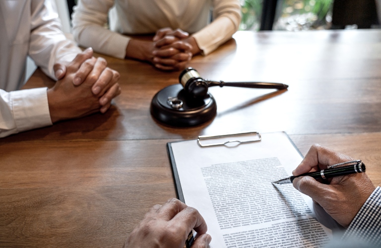 husband and wife during divorce process with lawyer