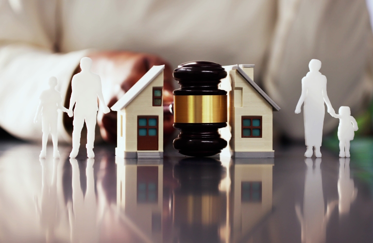 judge divides house in half with gavel between husband and wife