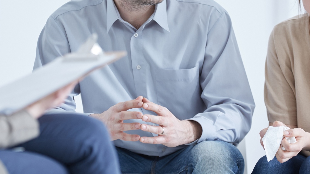 husband and wife are meeting with lawyer
