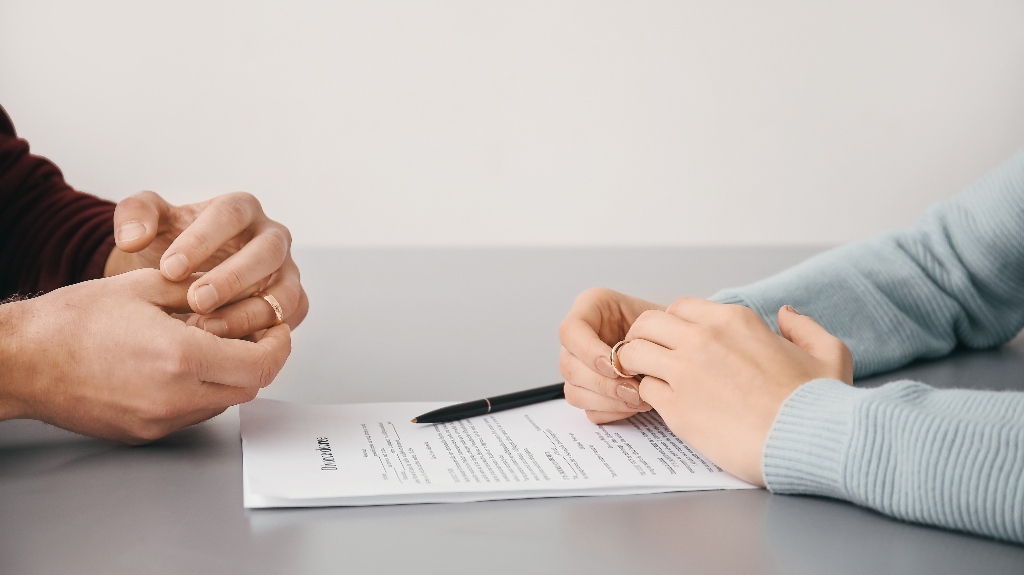 Couple with divorce decree in lawyer's office