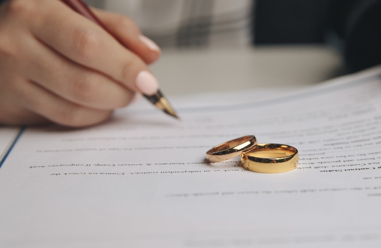 Woman is signing divorce documents