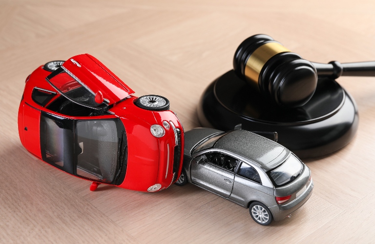 Two car models and judge's gavel