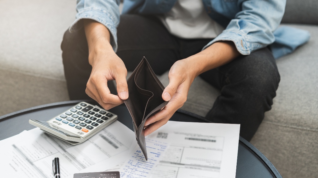 male hand opens empty wallet
