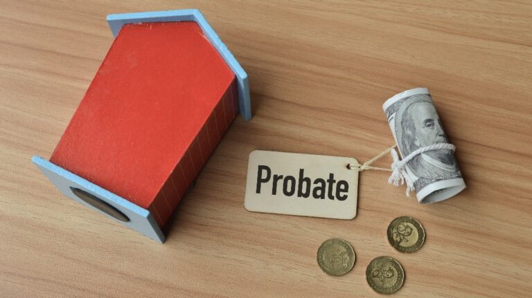Top angle view of toy wooden house, coins and word probate