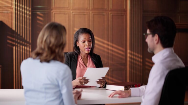 lawyer discussing paperwork with couple